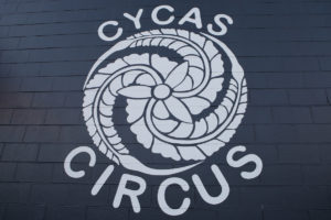 CYCAS logo on brick wall
